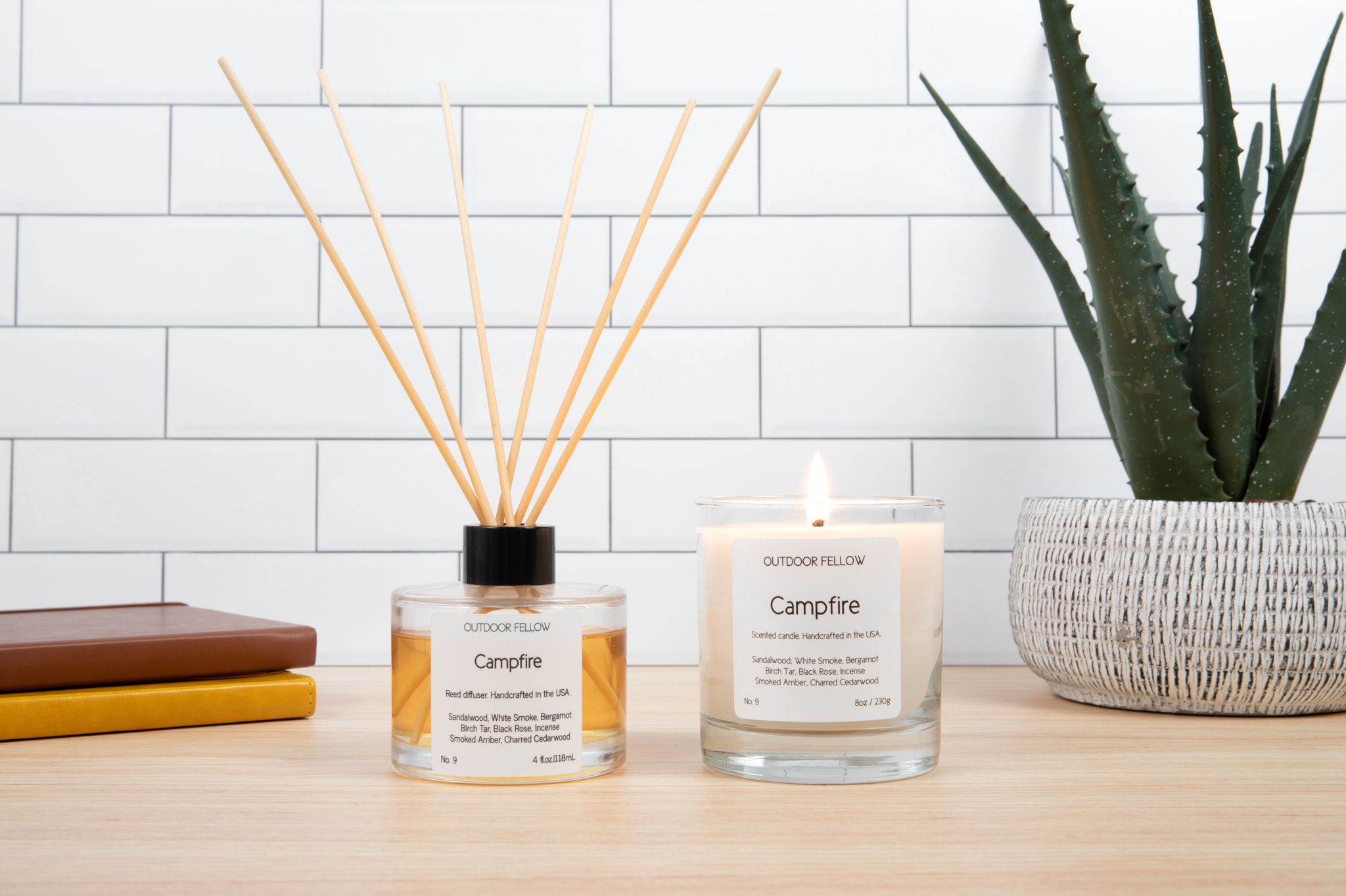 Campfire Reed Diffuser and Campfire Scented Candle next to each other on a desk