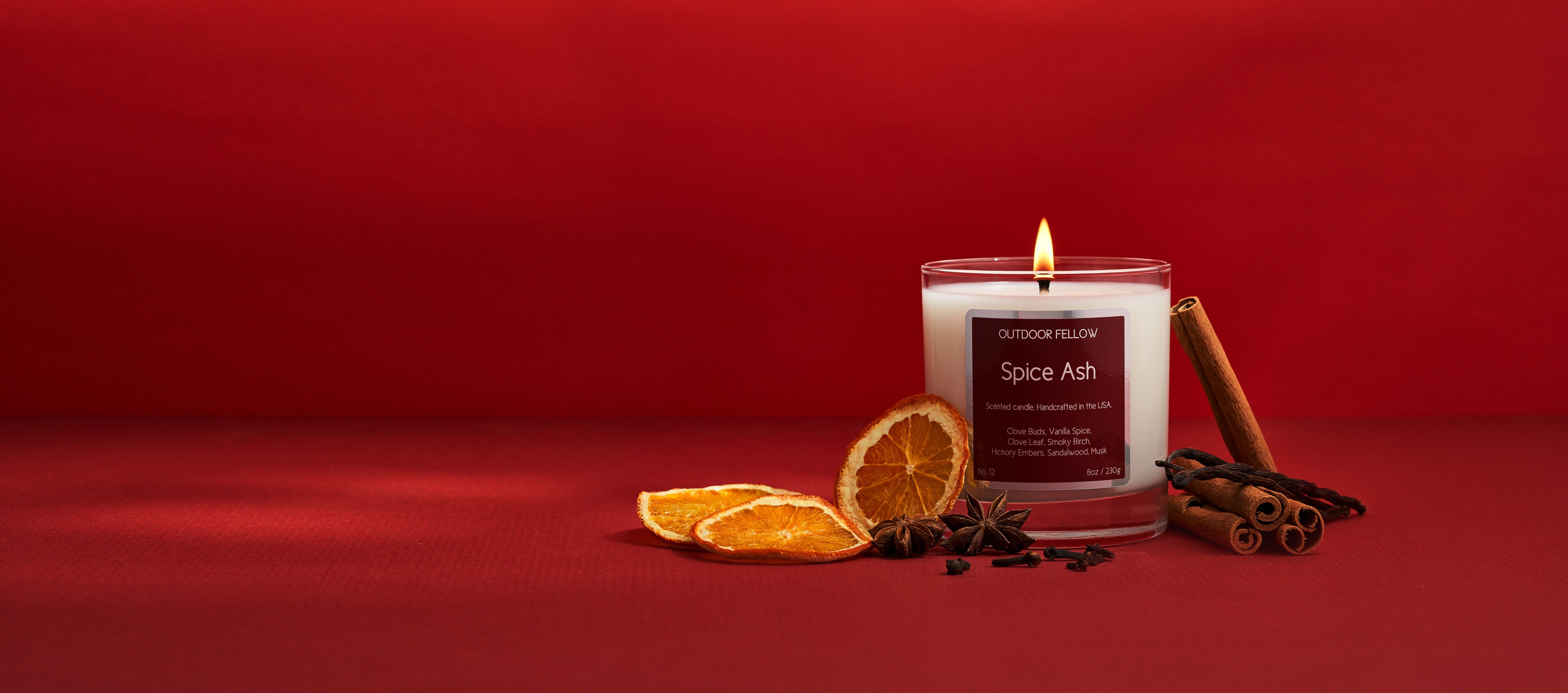 Spice Ash scented candle on red background