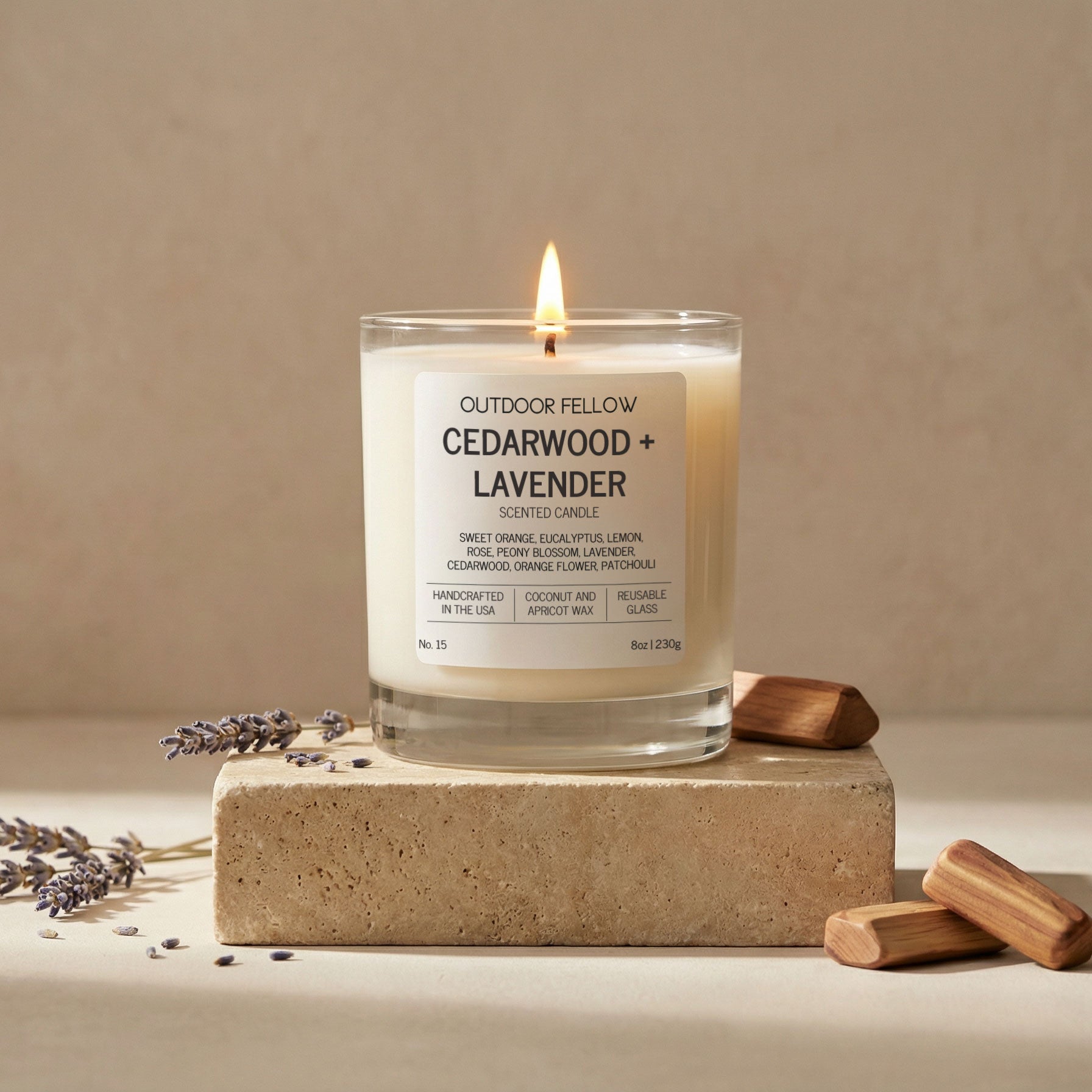 Candle labeled 'Cedarwood + Lavender' by Outdoor Fellow on a beige background