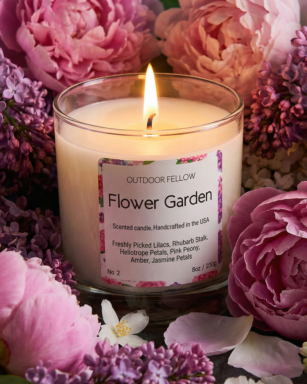 Floral candle labeled 'Flower Garden' surrounded by pink and purple flowers