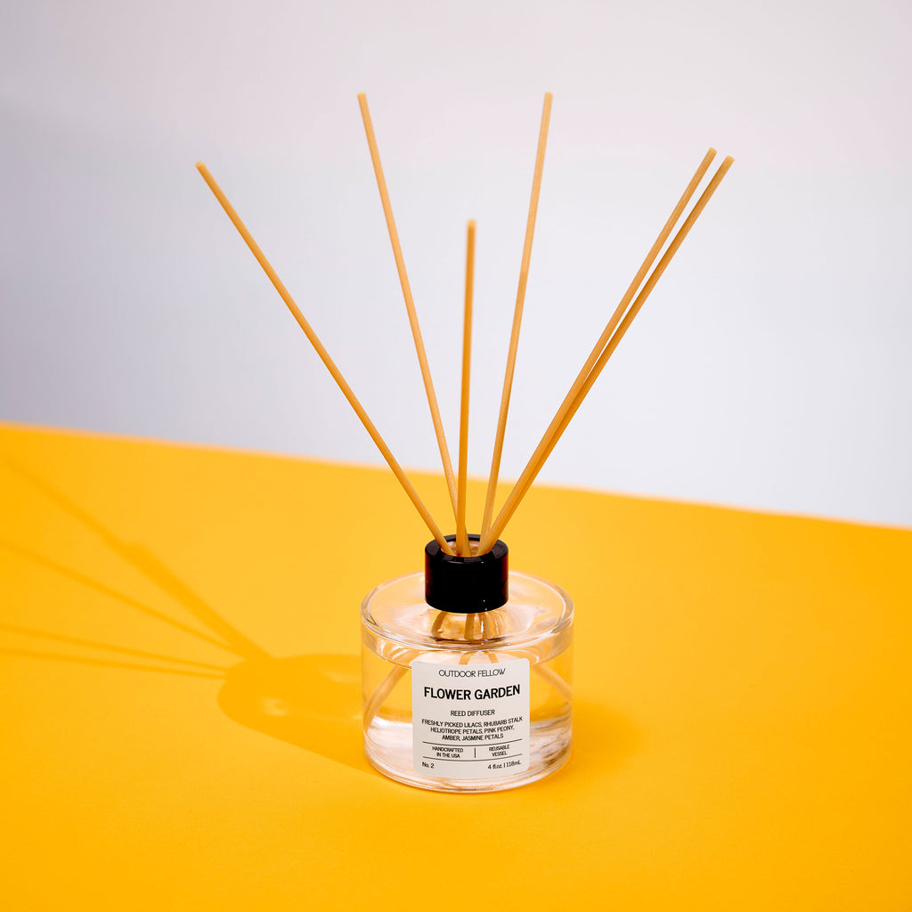 Flower Garden reed diffuser on a yellow surface