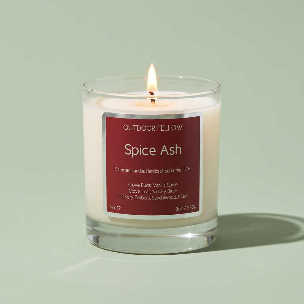 Spice Ash scented candle on a light green background
