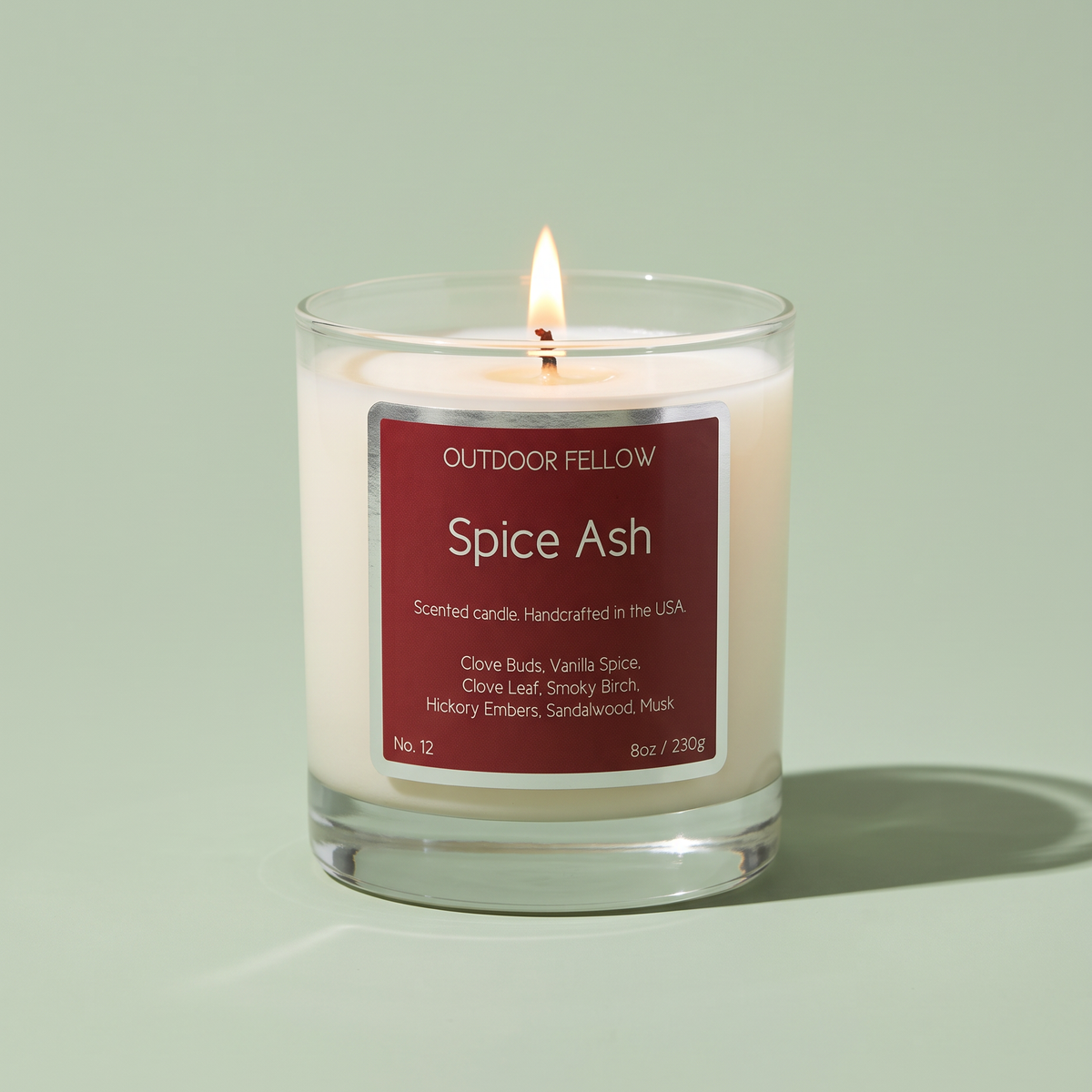 Spice Ash scented candle on a light green background