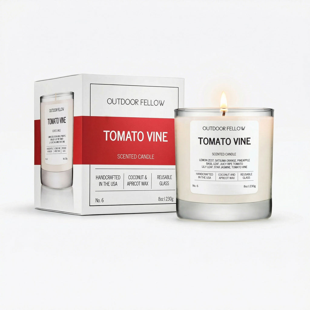 Scented candle labeled 'Tomato Vine' by Outdoor Fellow with packaging on a white background