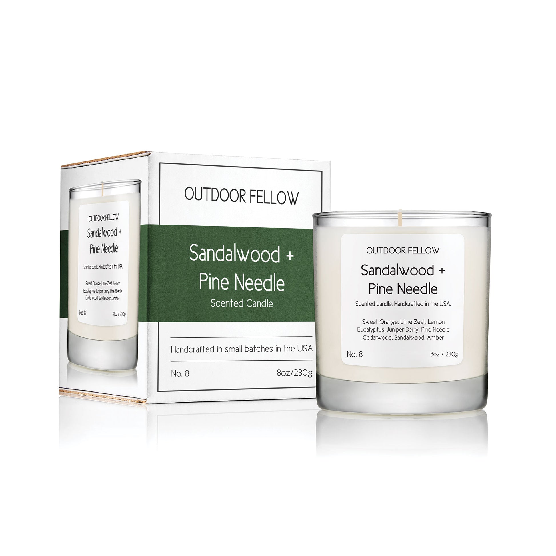 Sandalwood and Pine Needle scented candle next to packaging on white background