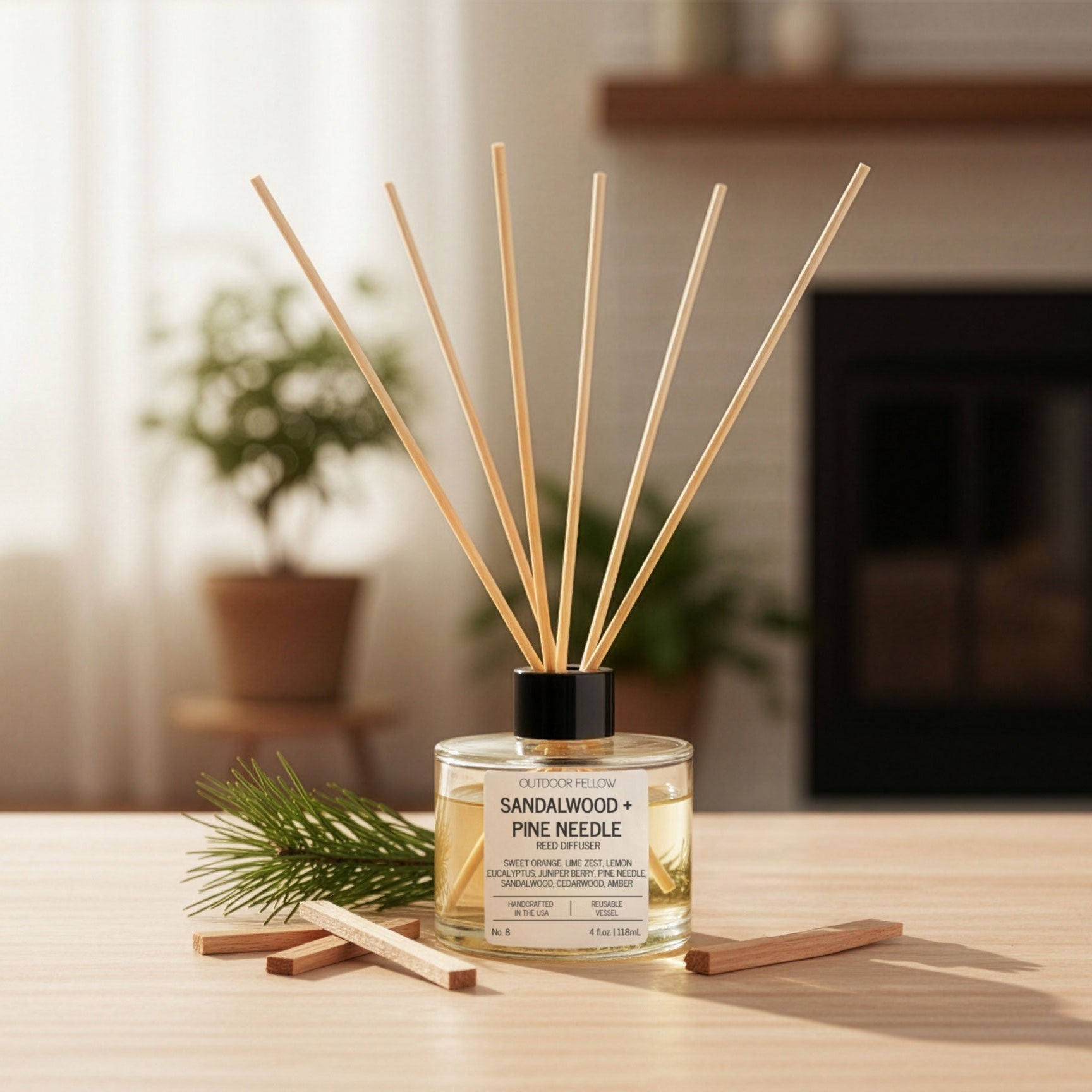 Reed diffuser with sandalwood and pine needle scent on a table in a home setting