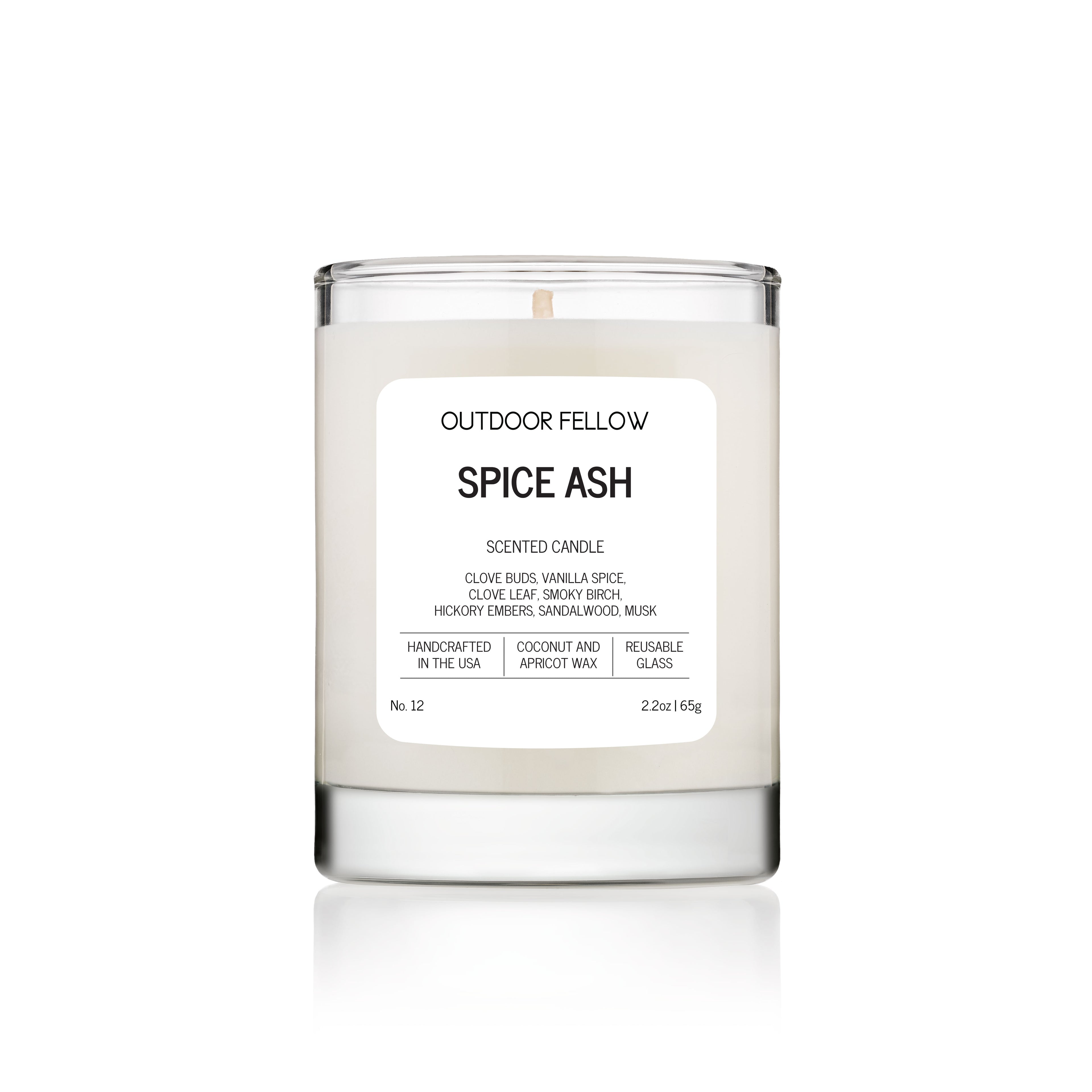 Candle labeled 'Spice Ash' by Outdoor Fellow on a white background