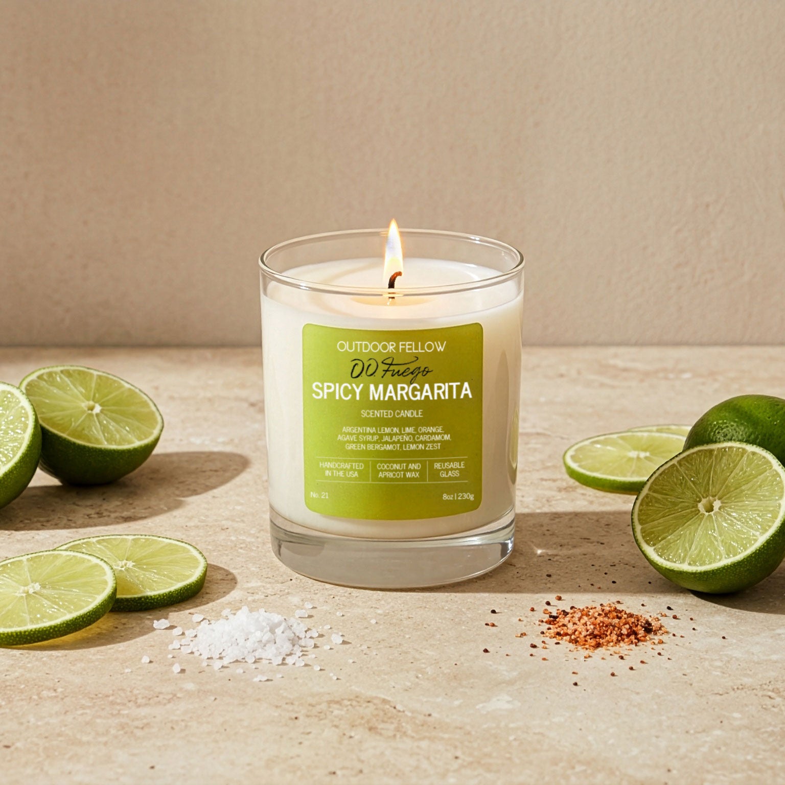 Spicy Margarita candle with lime slices on a wooden surface