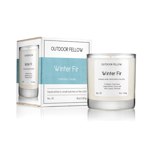 Winter Fir scented candle next to carton