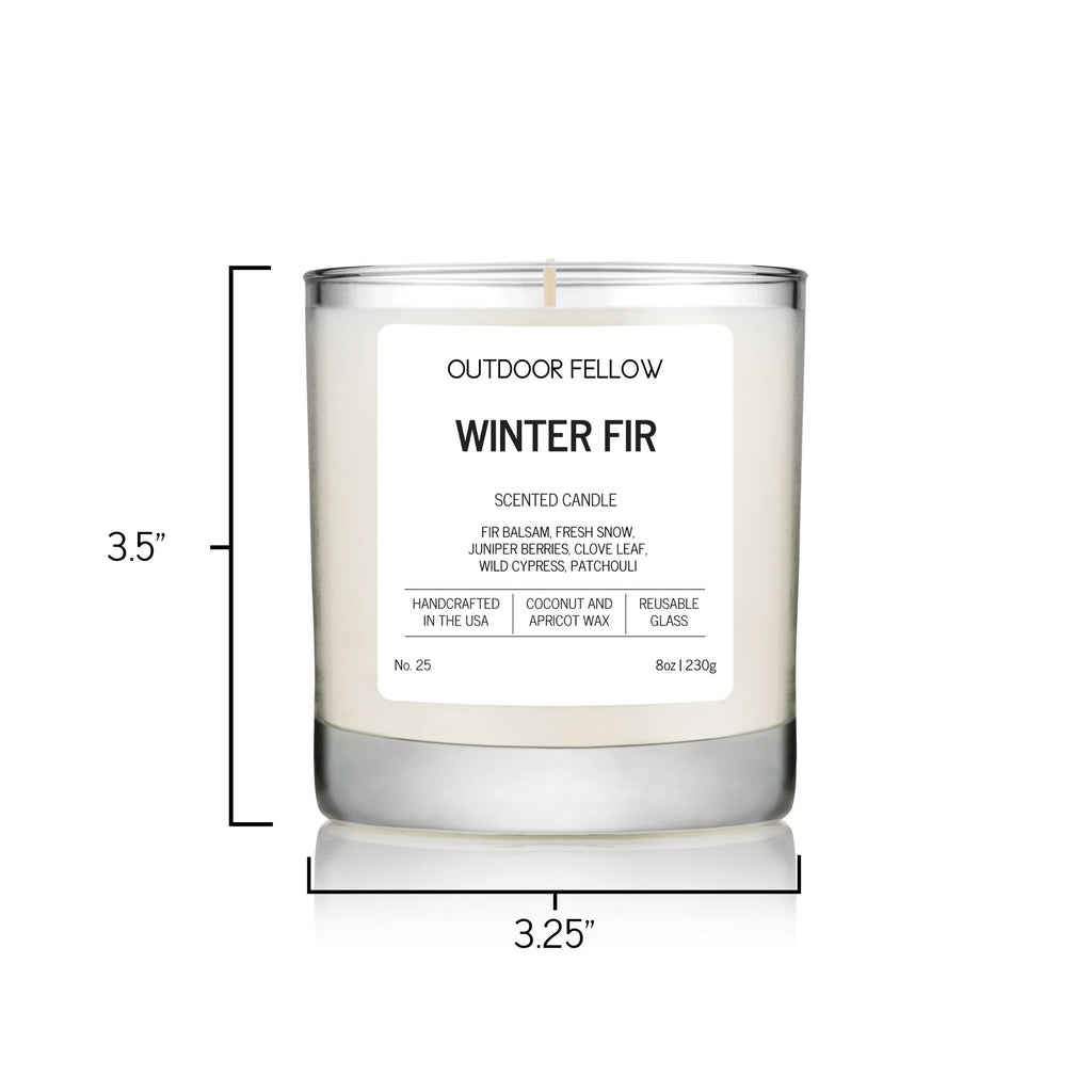 Outdoor Fellow Winter Fir candle with label shown, measuring 3.5 inches tall and 3.25 inches in diameter.