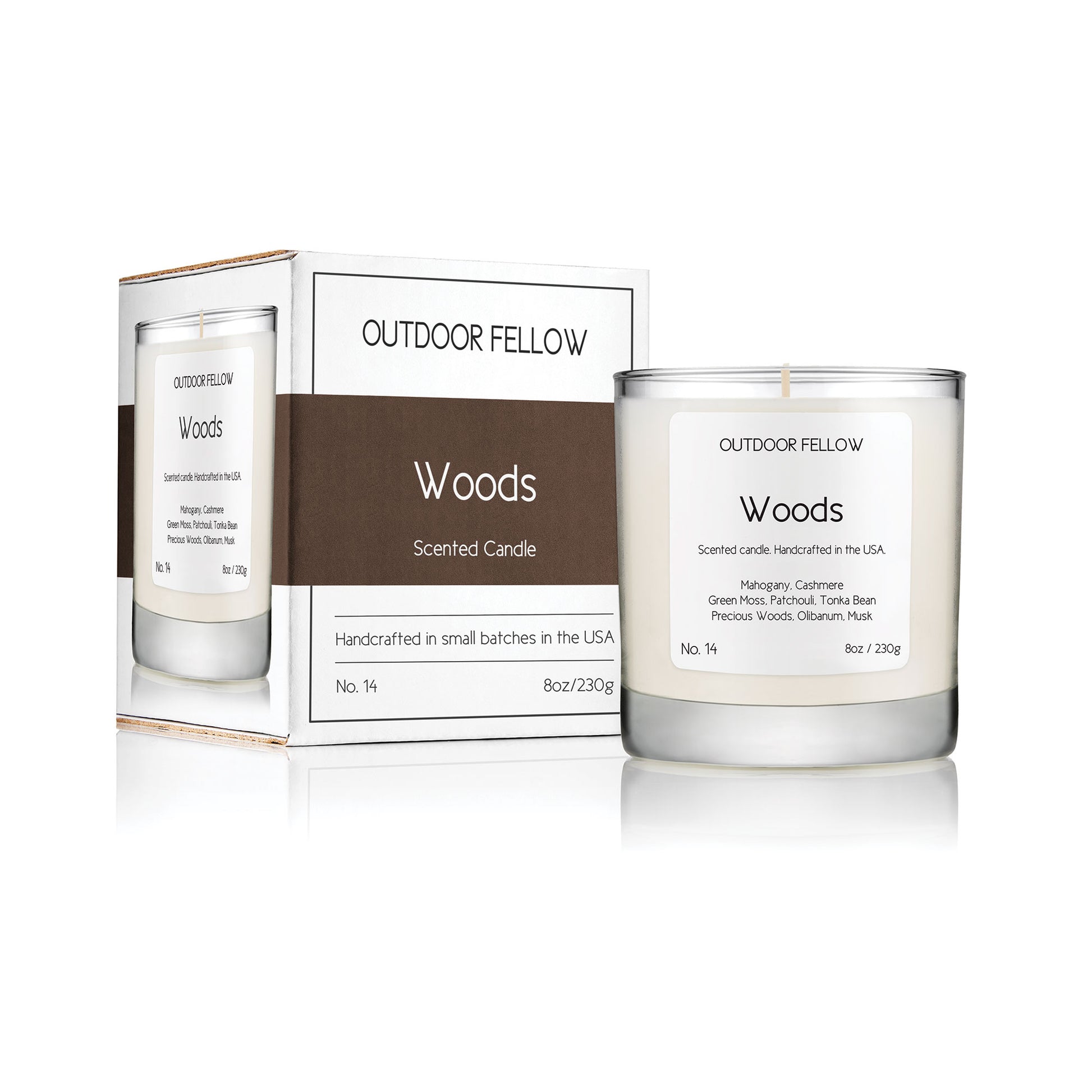 Woods scented candle next to packaging on white background