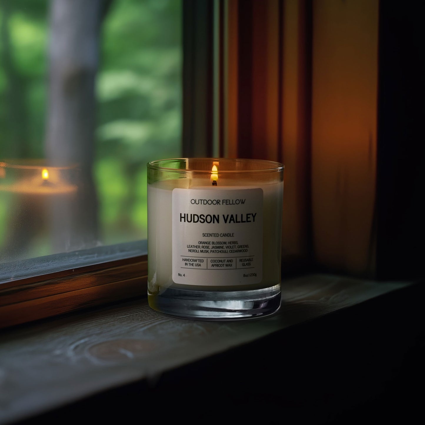 Hudson Valley scented candle on a window ledge