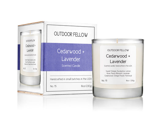 Cedarwood and Lavender scented candle next to packaging on white background