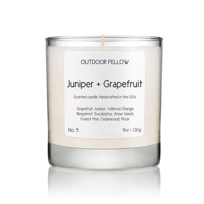 Juniper and Grapefruit scented candle on white background