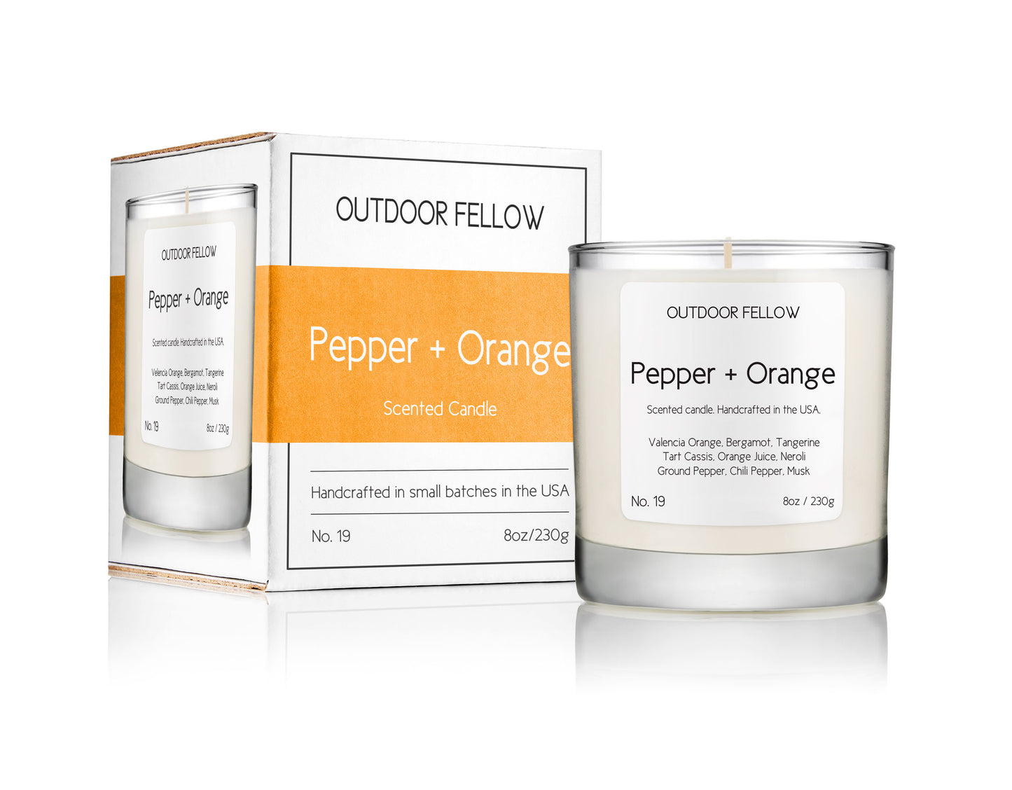 Pepper and Orange scented candle next to packaging on white background