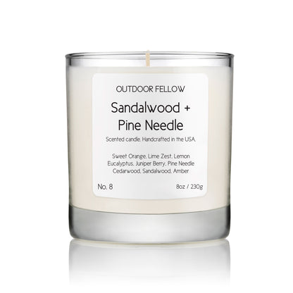 Sandalwood and Pine Needle scented candle on white background